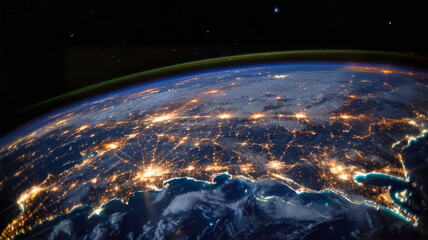 Obraz premium Earth at night from space showing city lights across the continent satellite