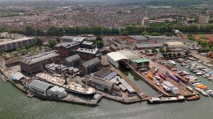 Bristol England: 28th July 2025: Drone view of Brunel's SS Great Britain rests at the dock in Bristol, surrounded by historic buildings along the River Avon