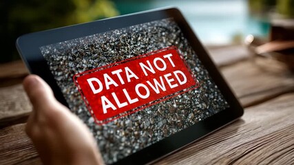 Data breach alert on tablet screen with finger touching display, warning of security threat and potential information leak, digital risk management - Powered by Adobe