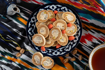 Uzbek Halva with Pistachios on Traditional Ceramic Plate
