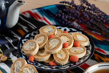 Uzbek Halva with Pistachios on Traditional Ceramic Plate