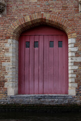 Bruges (Brugge), Belgium - October 17, 2022. Door and window of old houses in european city.