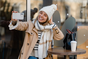 stylish woman walking in winter street