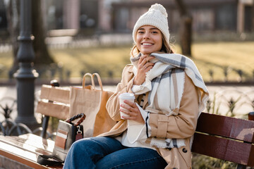 stylish woman walking in winter street