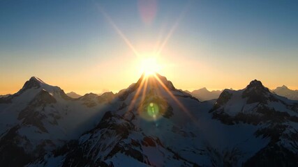 Spectacular sunrise over a snow-covered mountain peak, with a brilliant sunburst illuminating the alpine landscape - Powered by Adobe