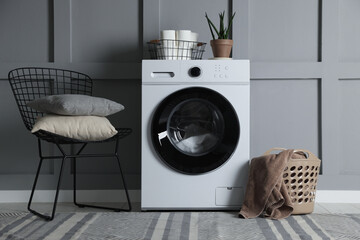 Laundry room with modern washing machine. Interior design