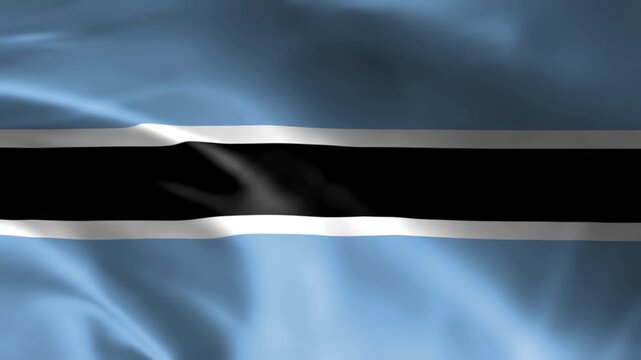 waving national flag of botswana featuring light blue field with black and white horizontal stripe