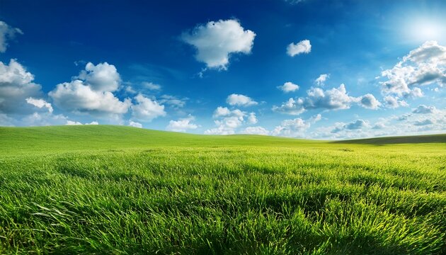 vibrant spring landscape features lush green grassy field under bright blue sky with fluffy white clouds evoking sense of tranquility and renewal