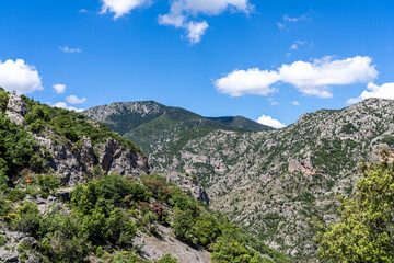 Obraz premium The Mountainous Rugged Countryside on the Peloponnese in Greece With Steep Hills and a Valley