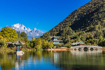 Near Old Town Lijiang is Jade Sprng Park with the Jade Dragon Snow Mountain, Moon Embracing Pagoda, Suocui Bridge and Black Dragon Pond in Yunnan, China