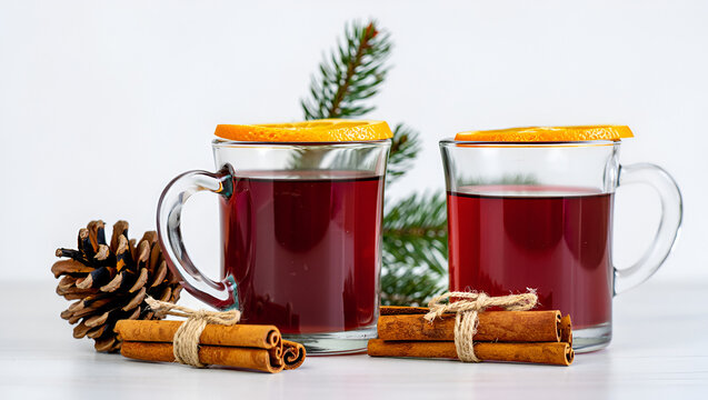 christmas mulled wine. mulled wine with spices. Two glasses of mulled wine with orange and cinnamon white background