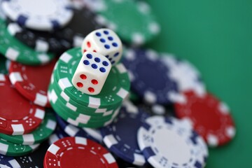 Dice game on the poker table in the casino. A successful combination of dice brought a lot of winning chips