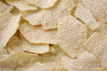 Homemade Flavored Paprika Potato Chips in a Bowl, top view. Flat lay