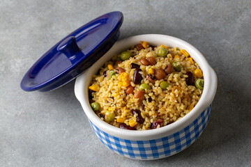 Bulgur pilaf with legumes; with peas, beans and corn kernels.