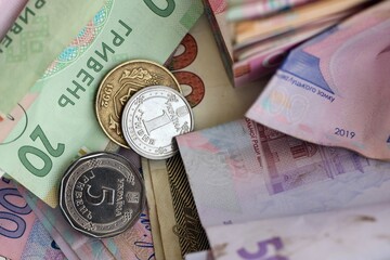 Big amount of different Ukrainian hryvnia money bills. Pile of crumpled ukrainian banknotes