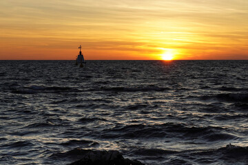 Beautiful sunset at the Adriatic Sea with waves