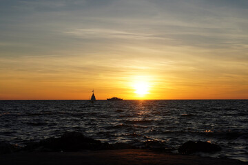Beautiful sunset at the Adriatic Sea with waves