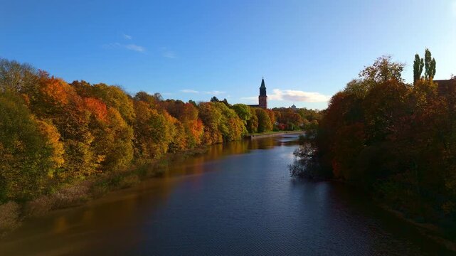 Autumn Drone View of Aurajoki River and Turku Cathedral, Finland
