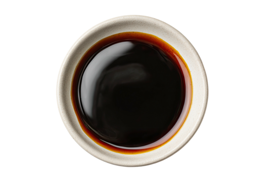 Top-down view of dark brown sauce in small bowl