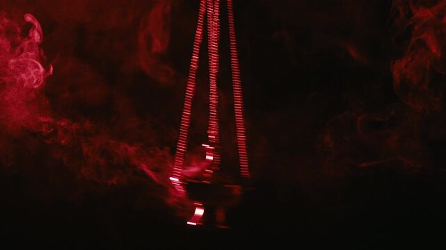 Swinging incense censer in slow motion during religious ritual 