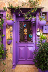 Colorful decorative doors of old houses in the streets of Ayvalik city center. Ayvalik - Turkey