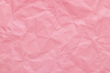 Baby pink color crumpled paper texture, blank template wrinkly background with copy space