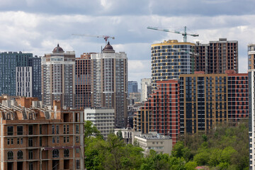 Urban High-Rise Construction with Tower Crane and Modern Apartments