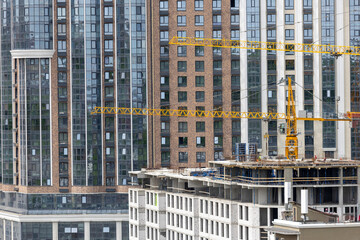 Urban High-Rise Construction with Tower Crane and Modern Apartments