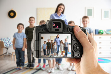 Protecting children's right to privacy in digital environment. Photographer taking photo of little...