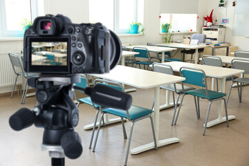 Protecting children's right to privacy in digital environment. Professional camera in empty classroom