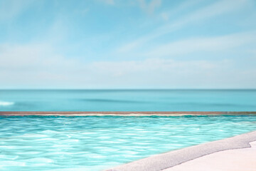 Fototapeta premium Swimming pool with clear water and infinity view on ocean