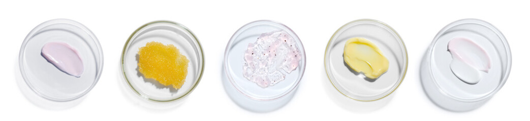 Petri dishes with cosmetic products on white background, top view
