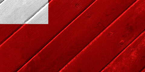 The official flag of Abu Dhabi, the capital of the United Arab Emirates, on wood texture. Conceptual collage