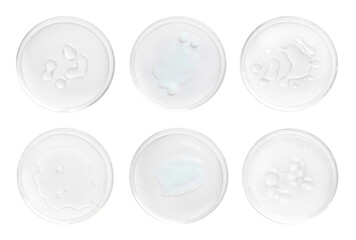 Petri dishes with cosmetic products on white background, top view