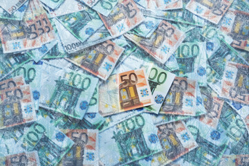 Money under ice. Many euro bills frozen