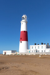 Red and white painted Portland Bill Lighthouse on the Isle of Portland, just south of Weymouth in the county of Dorset, UK