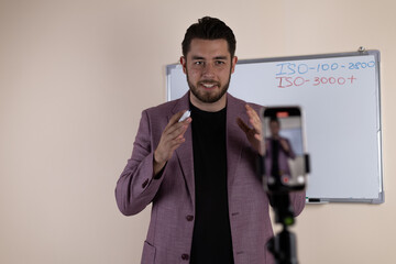 A journalist is preparing to record a video report on his smartphone