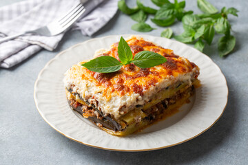 Traditional Greek potato and meat casserole with cheese - moussaka,