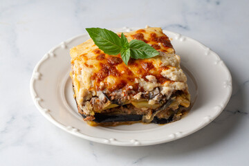 Traditional Greek potato and meat casserole with cheese - moussaka