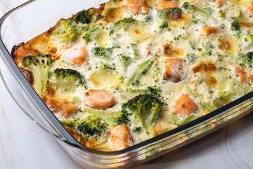 Homemade salmon and broccoli casserole with mozzarella cheese