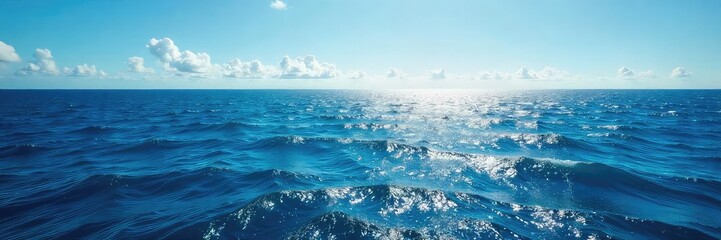Vast, deep blue ocean stretching to the horizon, sunlight reflecting on the waves, creating a mesmerizing seascape Perfect for travel, nature, and serenity themes , environment, calm