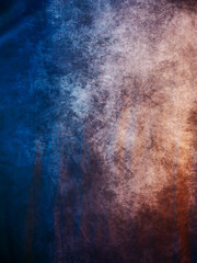 Painted canvas background with orange, grey and blue color for design.