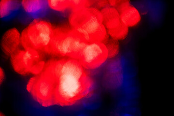 Red and blue color light leaks on dark background. Abstract backdrop for design purpose and special effects.