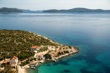 Naklejka premium Adriatic cove with rocky headland aerial view