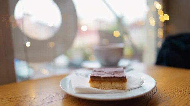 Charming cityscape background with inviting layered cake highlighting nighttime indulgence