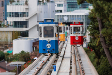 Naklejka premium Haeundae Blue Line Park, Busan, ride on multicoloured sky capsule train, railway tram route from Mipo to Cheongsapo station, coastal monorail in Busan, Yeongnam, South Korea, Republic of Korea travel