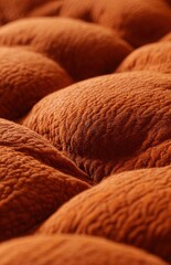 Obraz premium Close up orange textured quilted fabric background