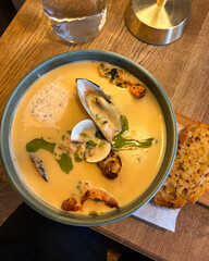 A bowl of warm seafood soup.