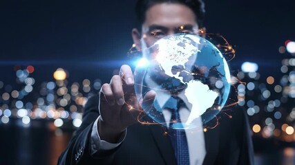 Businessman touching a glowing digital globe with network connections, representing global business and technology - Powered by Adobe