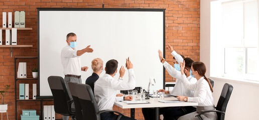 Business people having meeting in office during coronavirus epidemic